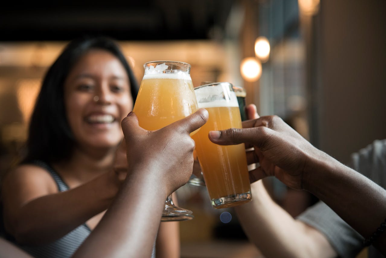 Friends toast beer glasses