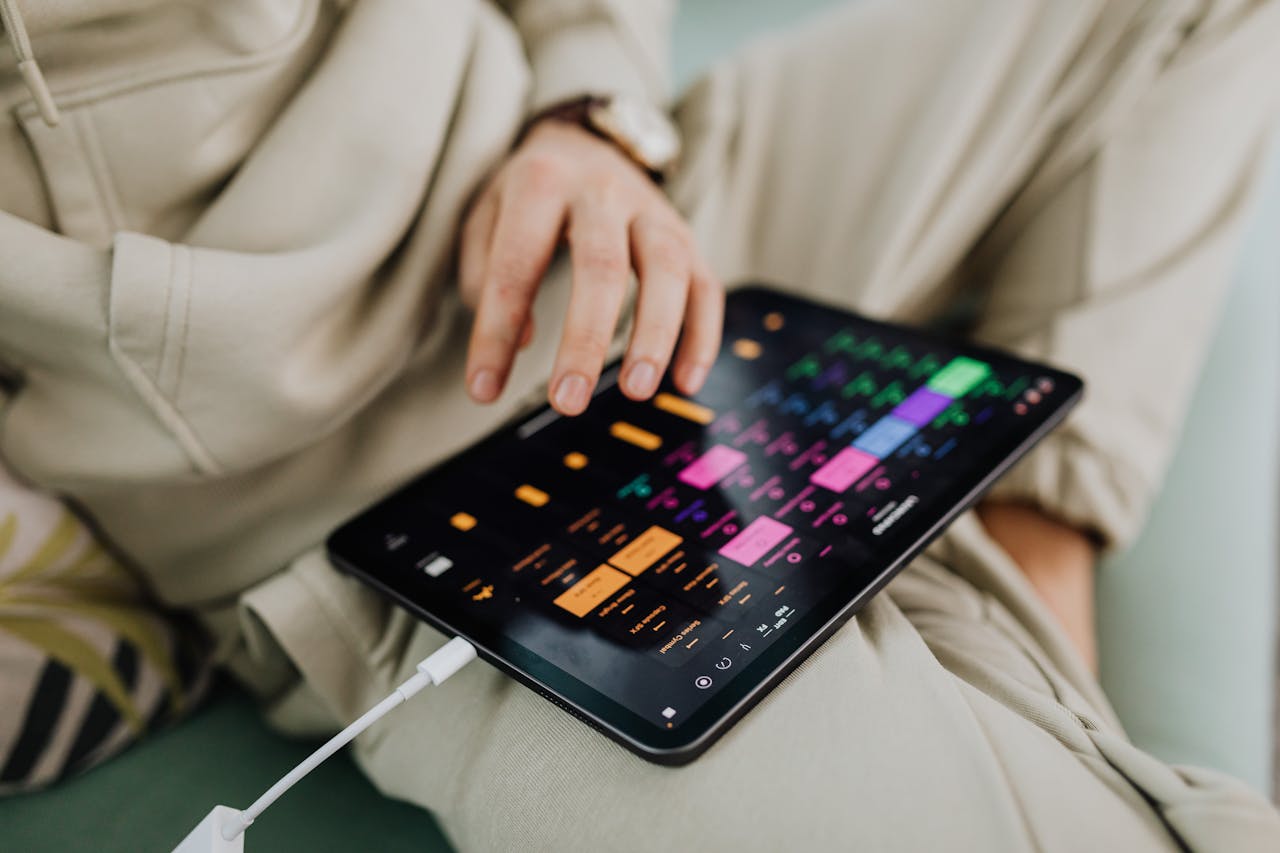 Close up of a hand adjusting settings on a tablet