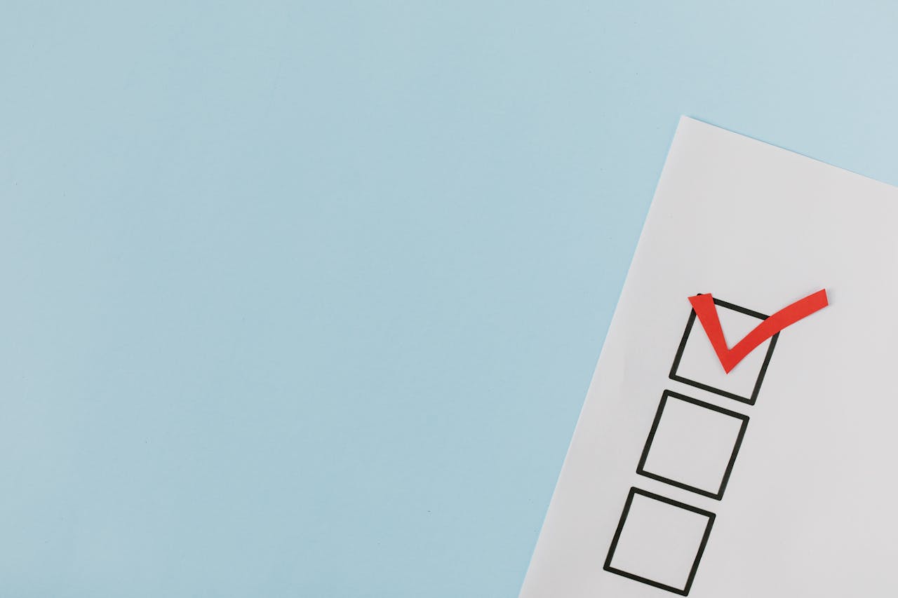 Close up of a simple check list against a light blue background