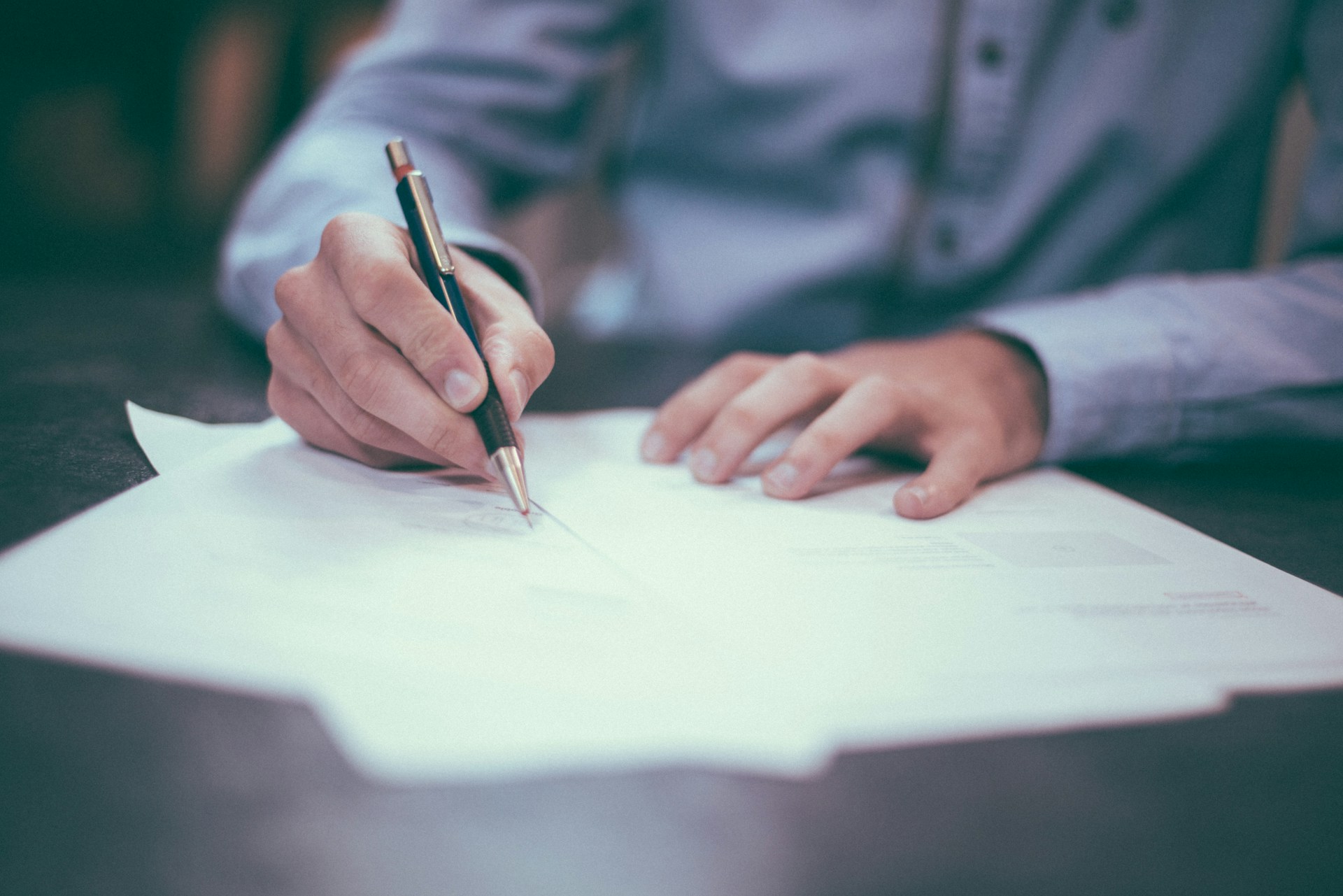 Someone signing a mortgage or loan